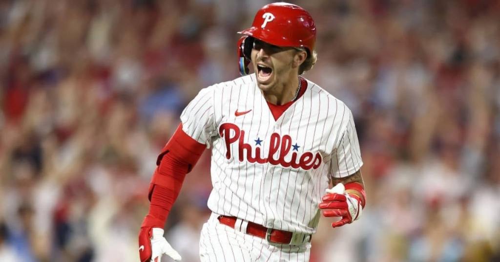 Bryson Stott #5 of the Philadelphia Phillies celebrates after hitting a grand slam