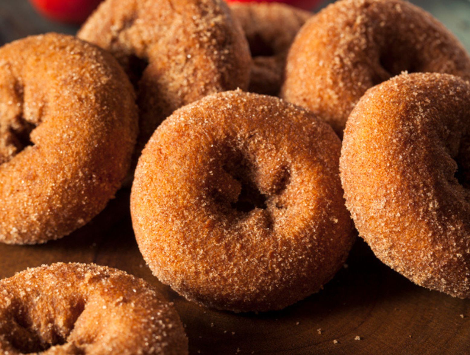 a photo of apple cider donuts on a brown table spots in pennsylvania to get apple cider donuts