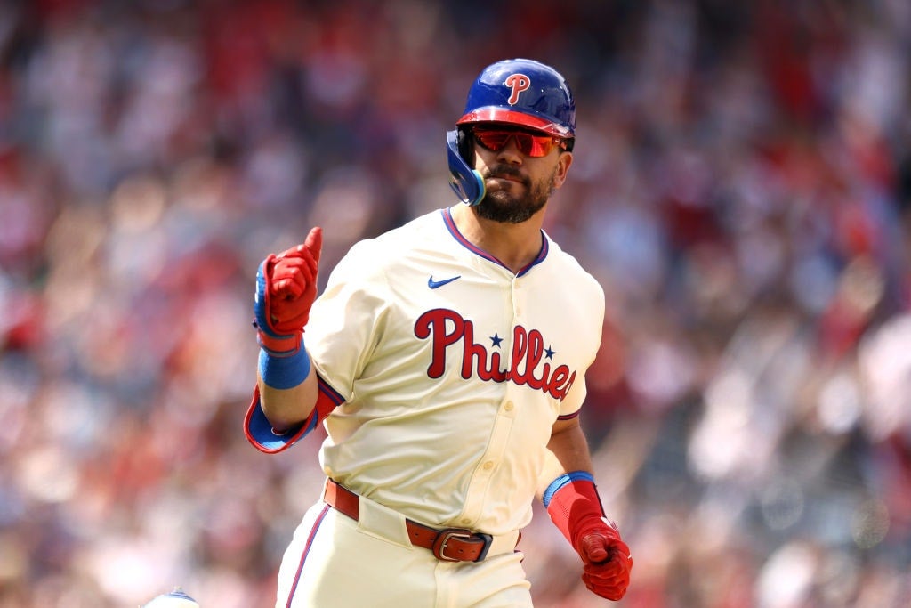 Kyle Schwarber #12 of the Philadelphia Phillies reacts after hitting a lead off solo home run 